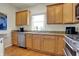 Kitchen boasts granite countertops, stainless steel dishwasher, and light wood cabinetry at 2037 Rhettsbury St, Carmel, IN 46032