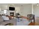 Spacious living room with a fireplace, comfortable seating, and hardwood floors at 2037 Rhettsbury St, Carmel, IN 46032