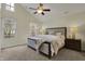 Spacious main bedroom features a ceiling fan, carpeted floor, and a vaulted ceiling at 2037 Rhettsbury St, Carmel, IN 46032