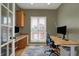 Home office featuring built-in desk, cabinetry, and bright natural light at 2037 Rhettsbury St, Carmel, IN 46032