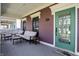 Charming front porch with comfortable seating and a decorative green door at 2037 Rhettsbury St, Carmel, IN 46032