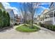 Serene street view showcasing a sidewalk surrounded by colorful houses and trees at 2037 Rhettsbury St, Carmel, IN 46032
