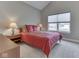 Bright bedroom featuring a bed and a window with backyard views, ideal for rest and relaxation at 2145 W Bedrock Ln, Greenfield, IN 46140