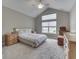 Spacious bedroom featuring a tray ceiling, plush carpeting, and bright natural light from the large windows at 2145 W Bedrock Ln, Greenfield, IN 46140