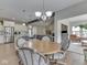 Open-concept dining area with a view of the modern kitchen and comfortable living space, perfect for entertaining at 2145 W Bedrock Ln, Greenfield, IN 46140
