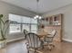 Cozy dining room with hardwood floors, a hutch, and a large window at 2145 W Bedrock Ln, Greenfield, IN 46140
