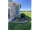 Exterior of the home displaying a garden area along the brick and siding of the home at 2145 W Bedrock Ln, Greenfield, IN 46140
