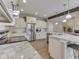 Spacious kitchen with granite countertops, stainless steel appliances, and ample cabinet space at 2145 W Bedrock Ln, Greenfield, IN 46140