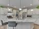 Bright, open kitchen with a large island, granite countertops, and modern finishes at 2145 W Bedrock Ln, Greenfield, IN 46140