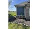 Landscaping of the home featuring decorative stones surrounding a mulched area with flowering plant at 2145 W Bedrock Ln, Greenfield, IN 46140