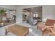 Cozy living area with hardwood floors, comfortable seating, and an open layout to the kitchen at 2145 W Bedrock Ln, Greenfield, IN 46140