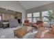Bright living room with vaulted ceilings, modern furnishings, and an adjacent living space at 2145 W Bedrock Ln, Greenfield, IN 46140