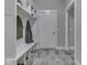 Functional mudroom with built-in storage, bench, and hooks, providing organization and convenience at 2145 W Bedrock Ln, Greenfield, IN 46140