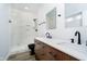 Modern bathroom featuring double sink vanity, white marble tile shower and stylish fixtures at 242 N Tacoma Ave, Indianapolis, IN 46201