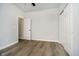 Neutral bedroom with wood-look flooring and closet space at 242 N Tacoma Ave, Indianapolis, IN 46201
