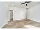 Spacious bedroom with gray walls, wood-look flooring and ceiling fan at 242 N Tacoma Ave, Indianapolis, IN 46201