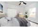 Comfortable bedroom showcasing a large bed, dresser and decorative elements at 242 N Tacoma Ave, Indianapolis, IN 46201