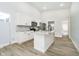 Kitchen featuring white cabinets, stainless steel appliances, and a marble-look countertop at 242 N Tacoma Ave, Indianapolis, IN 46201