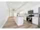 Kitchen featuring white cabinets, stainless steel appliances, and a marble-look countertop at 242 N Tacoma Ave, Indianapolis, IN 46201
