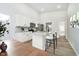 Kitchen featuring white cabinets, stainless steel appliances, and a marble-look countertop at 242 N Tacoma Ave, Indianapolis, IN 46201