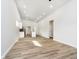Spacious living room featuring light gray walls and wood-look flooring at 242 N Tacoma Ave, Indianapolis, IN 46201