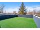 Spacious rooftop deck offering a private outdoor area with low-maintenance artificial grass at 242 N Tacoma Ave, Indianapolis, IN 46201