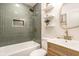 Elegant bathroom features green tiled shower, updated vanity, and modern fixtures at 2835 S Lyons Ave, Indianapolis, IN 46241