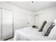 This bedroom features a comfortable bed with decorative pillows and a convenient closet, providing ample storage space at 2835 S Lyons Ave, Indianapolis, IN 46241