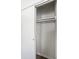 A closet provides essential storage with shelving and hanging rods, offering practical solutions at 2835 S Lyons Ave, Indianapolis, IN 46241