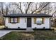Charming home with white siding, wood shutters, manicured lawn, and fresh landscaping at 2835 S Lyons Ave, Indianapolis, IN 46241