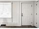 Bright, neutral room featuring white trim, a large window and an interior door at 2835 S Lyons Ave, Indianapolis, IN 46241