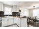 Stylish eat-in kitchen with butcher block countertops, honeycomb backsplash, and modern dining set at 2835 S Lyons Ave, Indianapolis, IN 46241