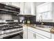 Contemporary kitchen design with stainless steel appliances, black honeycomb backsplash, and butcher block counters at 2835 S Lyons Ave, Indianapolis, IN 46241