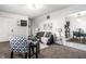 Open-concept living area with stylish furniture and decor connecting to the dining area at 2835 S Lyons Ave, Indianapolis, IN 46241