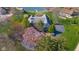 Scenic aerial view showcasing the house, surrounding trees and expansive backyard at 3849 Waycross Dr, Columbus, IN 47203