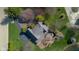 Overhead shot of a well-maintained home featuring a patio area and lush greenery at 3849 Waycross Dr, Columbus, IN 47203