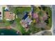 Stunning aerial view of a house with beautiful landscaping and lake access at 3849 Waycross Dr, Columbus, IN 47203
