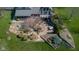 Aerial view of a meticulously landscaped backyard with a patio perfect for entertaining at 3849 Waycross Dr, Columbus, IN 47203