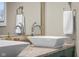 Bathroom with double vessel sinks, granite counters, and modern faucets at 3849 Waycross Dr, Columbus, IN 47203