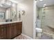 Bathroom features granite counters, modern vanity, glass shower, and decorative flooring at 3849 Waycross Dr, Columbus, IN 47203