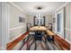 Bright dining room features modern light fixture, contemporary decor, and wood floors at 3849 Waycross Dr, Columbus, IN 47203
