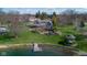Pictureque waterfront home with a manicured lawn, gazebo, and boat dock at 3849 Waycross Dr, Columbus, IN 47203