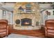 Stunning stone fireplace in living room with hardwood floors at 3849 Waycross Dr, Columbus, IN 47203