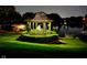 Waterfront gazebo on lush lawn, lit for an evening gathering at 3849 Waycross Dr, Columbus, IN 47203