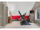 Bright home gym featuring various exercise equipment, a mounted TV, and a neutral color scheme for a motivating workout space at 3849 Waycross Dr, Columbus, IN 47203
