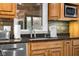 Kitchen featuring granite countertops, tile backsplash, and a stainless steel dishwasher at 3849 Waycross Dr, Columbus, IN 47203