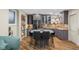 Modern kitchen and dining area with stainless steel appliances, sleek cabinetry, and a stylish central island at 3849 Waycross Dr, Columbus, IN 47203