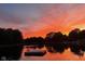 Stunning sunset reflecting over the lake at 3849 Waycross Dr, Columbus, IN 47203