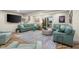 Spacious Gathering room with a comfortable sectional, large rug, and backyard access at 3849 Waycross Dr, Columbus, IN 47203