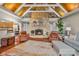 Inviting living room with vaulted wood ceilings and a floor-to-ceiling stone fireplace at 3849 Waycross Dr, Columbus, IN 47203